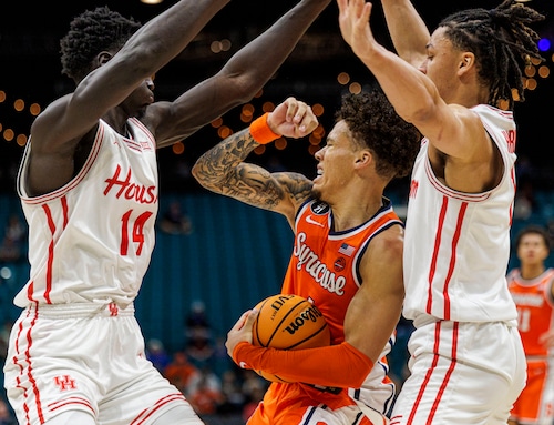 Syracuse guard Nate Kingz tries to get past two Houston defenders in a 78-74 overtime loss to the 3rd-ranked Cougars on Monday at the Players Era Festival in Las Vegas.
 (N. Scott Trimble | strimble@syracuse.com)