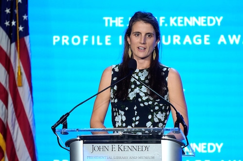 FILE - Tatiana Schlossberg, the daughter of Caroline Kennedy and Edwin Schlossberg, addresses an audience during the John F. Kennedy Profile in Courage Award ceremony, at the John F. Kennedy Presidential Library and Museum in Boston,  Oct. 29, 2023. (AP Photo/Steven Senne, File)