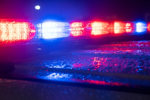 An unmarked police cruiser flashes its emergency lights during The Big E on the Avenue of The States in West Springfield, Mass. on Wednesday, September 24, 2025.
