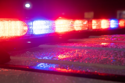 An unmarked police cruiser flashes its emergency lights during The Big E on the Avenue of The States in West Springfield, Mass. on Wednesday, September 24, 2025.