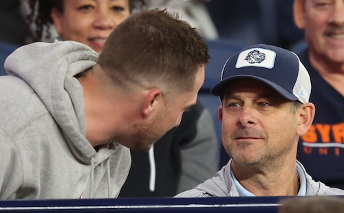 A New York Yankee fan asks Aaron  Boone the Yankee manager.  is asked to have his photo taken.  The Syracuse Orange football team take on the North Carolina Tar Heels at the JMA Wireless Dome Oct 31, 2025. Dennis Nett | dnett@syracuse.com