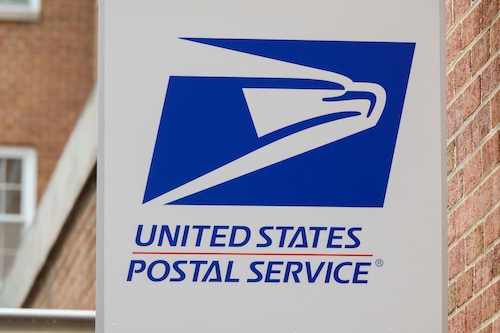 A United States Postal Service (USPS) is displayed outside of a delivery office on May 31, 2025 in Washington, DC. (Photo by Kevin Carter/Getty Images)