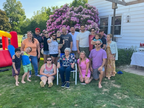 Azalia King sits amid many of her 20 grandchildren and 16-great-grandchildren at the home where she lives on Caughdeoy Road in Clay. The county is pressuring her to move to make way for Micron Technology. Special to Syracuse.com