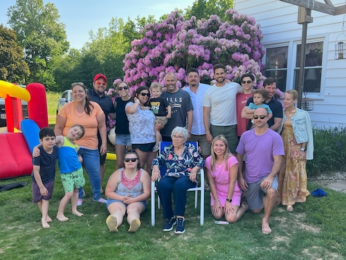 Azalia King sits amid many of her 20 grandchildren and 16-great-grandchildren at the home where she lives on Caughdeoy Road in Clay. The county is pressuring her to move to make way for Micron Technology. 