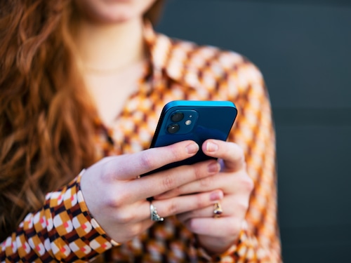 Close up of woman using smart phone