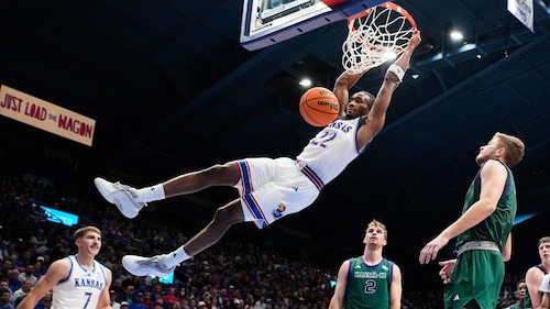 Kansas guard Darryn Peterson dunks the ball during the first half of an NCAA college basketball game against the Green Bay, Monday, Nov. 3, 2025, in Lawrence, Kan.