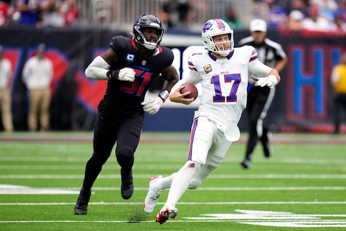 Buffalo Bills quarterback Josh Allen tries to scramble away from Houston Texans defensive end Will Anderson Jr. during an NFL game on Oct. 6, 2024, at NRG Stadium in Houston.
