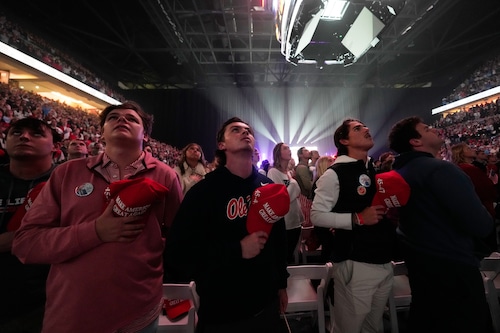 Attendees stand for the national anthem at a "This Is the Turning Point" campus tour event at the University of Mississippi, in Oxford, Miss., Wednesday, Oct. 29, 2025. (Gerald Herbert | AP)