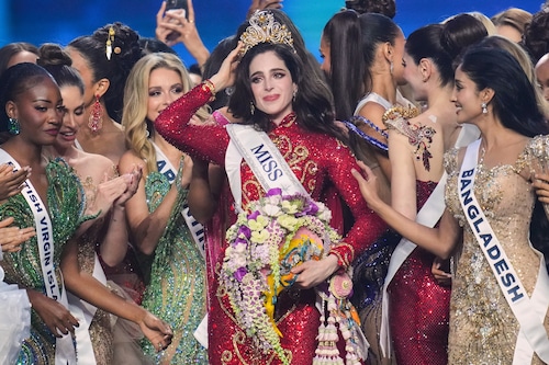 Miss Mexico Fatima Bosch, center, is celebrated by other contesters after winning the 2025 Miss Universe pageant in Nonthaburi, north of Bangkok, Thailand, Friday, Nov. 21, 2025. (AP Photo/Sakchai Lalit)