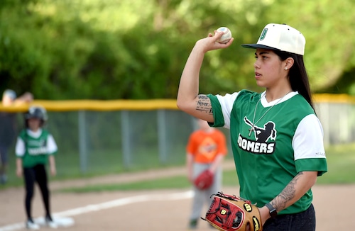 Assistant Coach / Pitcher Nadia Diaz pitches to the batter. The Upstate Boomers girls baseball team played its first-ever game on Sunday night at Shove Park in Camillus. (Charlie Miller | cmiller@syracuse.com)