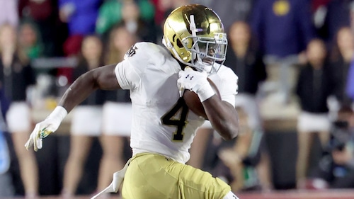 Boston College defensive back Omar Thornton (0) tackles Notre Dame running back Jeremiyah Love (4) during the second half of an NCAA college football game Saturday, Nov. 1, 2025, in Boston. (AP Photo/Mark Stockwell)