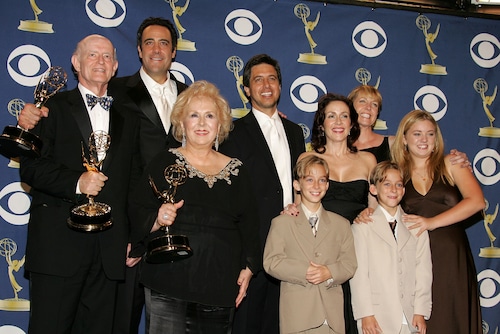 The cast of 'Everybody Loves Raymond', (L-R) Peter Boyle, Brad Garrett, Doris Roberts, Ray Romano, Patricia Heaton, Monica Horan, Sawyer Sweeten, Sullivan Sweeten and Madylin Sweeten pose with the Emmy for Outstanding Comedy Series in the press room at the 57th Annual Emmy Awards on September 18, 2005 in Los Angeles, California.  (Photo by Frazer Harrison/Getty Images)