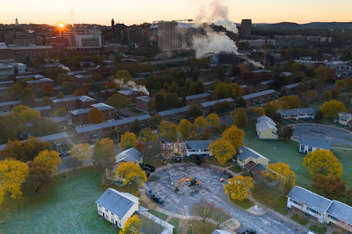 Demolition begins on the McKinney Manor apartments along East Adams Street, Tuesday, October 28, 2025. Environmental cleanup has also started on a vacant lot along Burt Street.