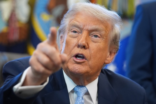President Donald Trump answers questions from reporters in the Oval Office of the White House, Monday, Nov. 17, 2025, in Washington. (AP Photo/Evan Vucci)