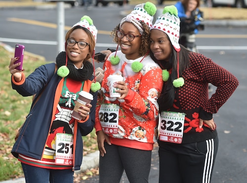 From left, Alisha Lorenzo, Kimberly Middleton, and Shawna Pace poses for a photo during the Syracuse Ugly Sweater 5K at Onondaga Lake Park in 2017. 
Scott Schild | sschild@syracuse.com SYR