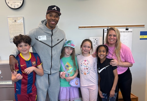 Isaac McClintock, author Stan Tucker, Caroline Mattern, Estelle Campagna and 
Demi Mugaya are pictured with librarian the school’s librarian, Katie McGinnis (right).