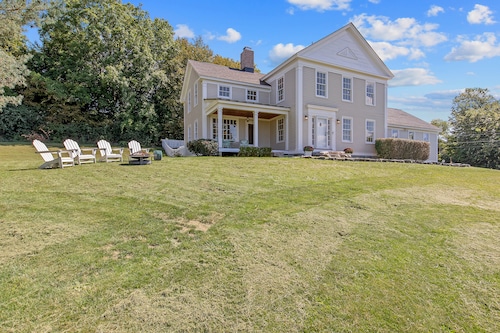 - "Attracted" to older style homes, but looking to avoid the maintenance headaches of historic houses, Chris Dembs sought a Vermont company to build a replica 1850s New England Greek Revival farmhouse at 4477 Cole Road, on Onondaga Hill, in 2012. Adirondack chairs sit around a fire pit gazing to the west. Courtesy of CST Media Productions, LLC.