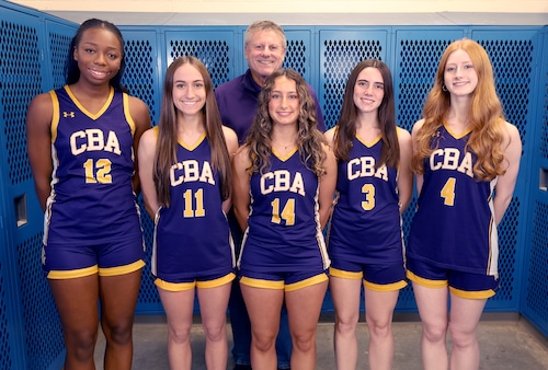 Christian Brothers Academy girls basketball team, from left, Liana Thomas, Juliet Zimmerman, coach Mike Cariseo, Cara Macaluso, Margaret Kuehner and Leah Stark at syracuse.com’s winter sports media day on Wednesday, Nov. 12, 2025, at Cicero-North Syracuse High School. Dennis Nett | dnett@syracuse.com