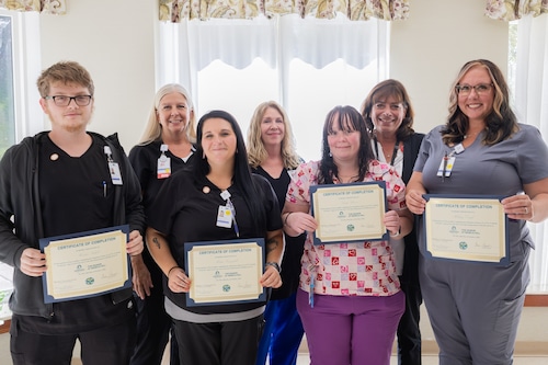 Four new CNAs recently graduated from The Manor’s on-the-job training program to start their journey in healthcare.  Pictured left to right: (Front row) Graduates, Hunter Nichols, Melissa Campbell, Linda Bower, and Hillary Doyle. (Second row)  Director of nursing at The Manor, Joanne Burcroff, clinical care coordinator, Carrie Thornber, and  executive director, Andrea Doviak.
